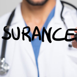 A doctor writing out insurance