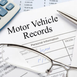 A paper with motor vehicle records written on it